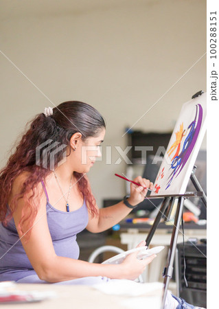 Painting artwork leisure at home. Enjoy weekend hobby. South american venezuelan mid woman close-up 100288151