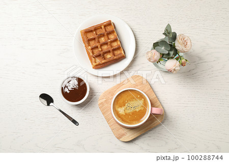 Flat lay composition with coffee on white wooden table. Tasty breakfast Flat lay composition with coffee on white wooden table. Tasty breakfast 100288744