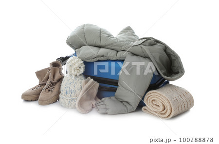 Suitcase with warm clothes isolated on white. Winter vacation 100288878