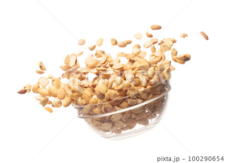 Roasted Peanut bean fall throw up in glass bowl, Roasted Peanut bean float explode, abstract cloud fly. Roasted Peanut beans splash throwing in Air. White background Isolated high speed shutter 100290654