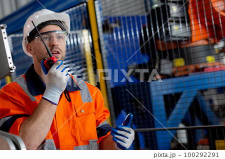 Young caucasian engineer man inspection robot arms technology intelligence. 100292291