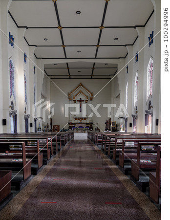 Interior view of St. Joseph Catholic Church contains stained glass windows designed and crafted Interior view of St. Joseph Catholic Church contains stained glass windows designed and crafted 100294996