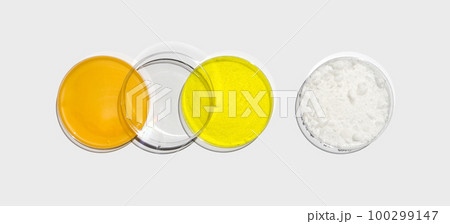 Shower cream, Potassium Chromate powder and Cetyl Esters Wax in petri dish with plastic lid on white laboratory table. Chemical ingredient for cosmetics and toiletries product. Top View 100299147