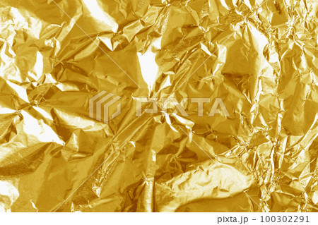 Gold foil leaf shiny texture, abstract yellow wrapping paper for background and design art work. Gold foil leaf shiny texture, abstract yellow wrapping paper for background and design art work. 100302291