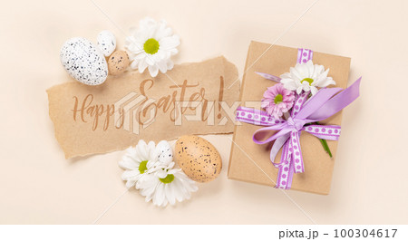 Gift box, Easter eggs and flowers Gift box, Easter eggs and flowers 100304617
