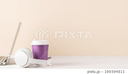 Laptop, headphones and coffee cup 100304811