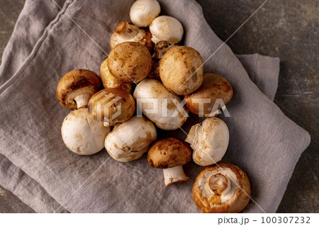 Champignon mushroom on the table. Champignon mushroom on the table. 100307232