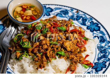 stir-fried basil with pork and fried egg stir-fried basil with pork and fried egg 100309344