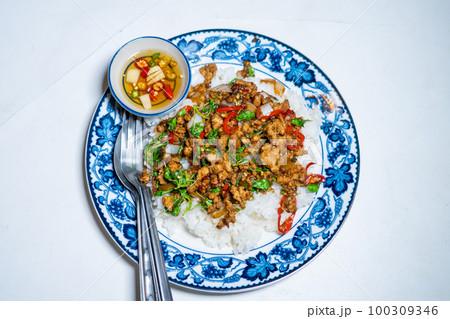 stir-fried basil with pork and fried egg stir-fried basil with pork and fried egg 100309346