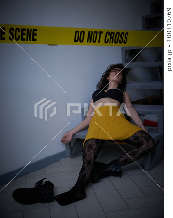 young woman lying dead on the floor after rape 100310769