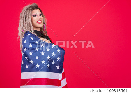Distracted transgender person wrapping with a north america national flag Distracted transgender person wrapping with a north america national flag 100313561