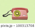 Playful retro phone with a disc of fruit kiwi. 100313708