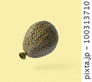 A playful collage of a kiwi ball flies on a yellow background. Minimal creative concept of food and 100313710