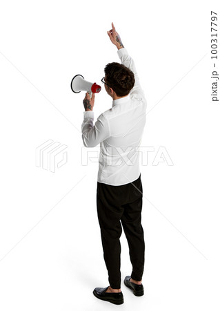Young man shouting at megaphone isolated over white background. Concept of business, office lifestyle, success, career, finance, ad. Isometric view Young man shouting at megaphone isolated over white background. Concept of business, office lifestyle, success, career, finance, ad. Isometric view 100317797
