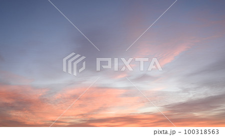 Sky with soft and fluffy pastel pink and blue colored clouds. Sunset background. Nature. sunrise. Instagram toned style Sky with soft and fluffy pastel pink and blue colored clouds. Sunset background. Nature. sunrise. Instagram toned style 100318563
