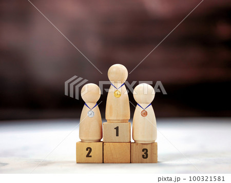 Achievement concept. Wooden podium 1, 2, 3, human standing on podium with ranking winner business and sport competition concept copy space 100321581