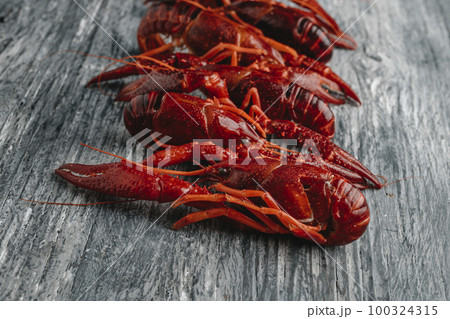 closeup of some cooked crayfish on a table 100324315