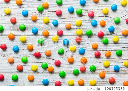 colorful candies as background top view. Seamless pattern with candy. Many sweet candies close-up colorful candies as background top view. Seamless pattern with candy. Many sweet candies close-up 100325386