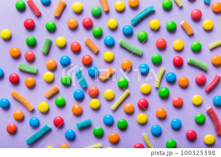 colorful candies as background top view. Seamless pattern with candy. Many sweet candies close-up 100325398