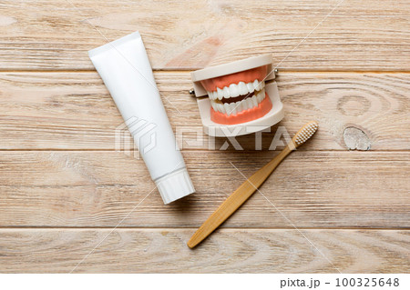 Mouthwash and other oral hygiene products on colored table top view with copy space. Flat lay. Dental hygiene. Oral care kit. Dentist concept Mouthwash and other oral hygiene products on colored table top view with copy space. Flat lay. Dental hygiene. Oral care kit. Dentist concept 100325648