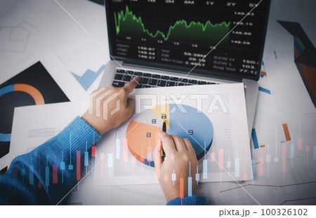 Man using laptop with planning and strategy, Stock market, Business growth down, Concept of financial crisis, echnical price graph and indicator, red candlestick chart with analyzing forex trading. Man using laptop with planning and strategy, Stock market, Business growth down, Concept of financial crisis, echnical price graph and indicator, red candlestick chart with analyzing forex trading. 100326102