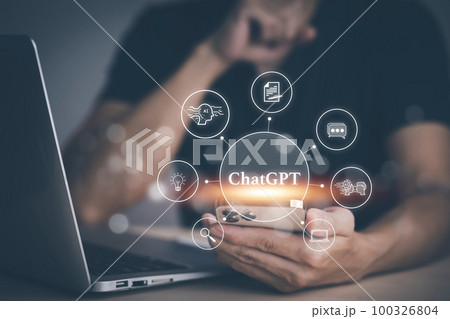 Man using Laptop or Smartphone With ChatGPT Chat with AI, Artificial Intelligence,System Artificial intelligence an artificial intelligence chatbot, Digital chatbot,robot application, conversation 100326804