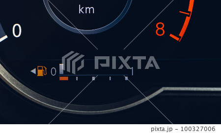 Empty fuel warning light in car dashboard. Fuel pump icon. 100327006