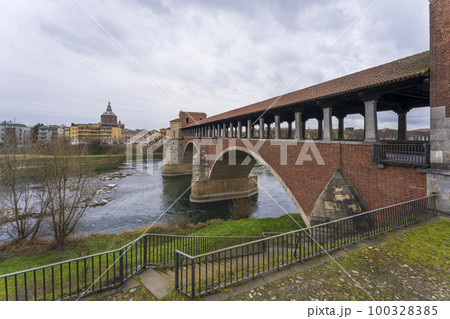 Beautiful view of bridge over Ticino river in Pavia at overcast day 100328385