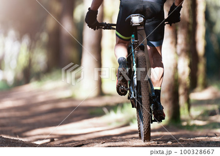 Mountain biking man riding on bike in summer mountains forest landscape 100328667