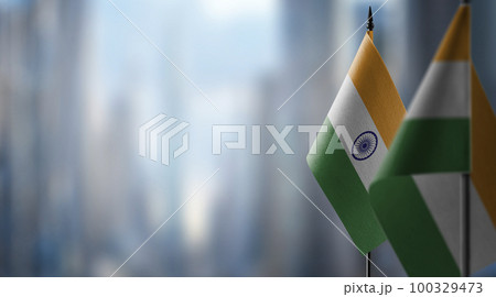 Small flags of the India on an abstract blurry background Small flags of the India on an abstract blurry background 100329473