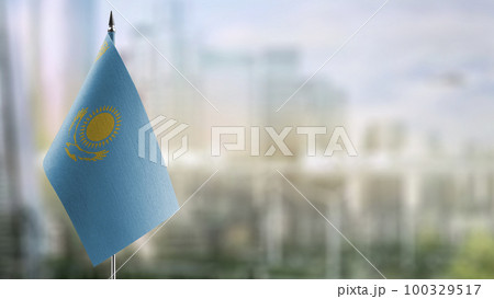 A small Kazakhstan flag on an abstract blurry background A small Kazakhstan flag on an abstract blurry background 100329517
