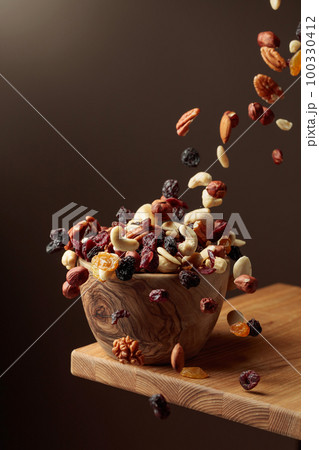 Flying dried fruits and nuts. 100330412