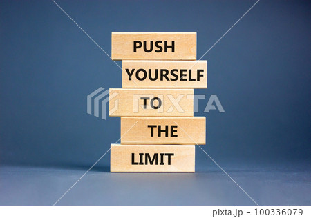 Push the limit symbol. Concept words Push yourself to the limit on wooden blocks. Beautiful grey table grey background. Business push the limit concept. Copy space. Push the limit symbol. Concept words Push yourself to the limit on wooden blocks. Beautiful grey table grey background. Business push the limit concept. Copy space. 100336079