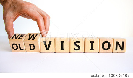 New or old vision symbol. Businessman turns cubes and changes words 'old vision' to 'new vision'. Beautiful white table, white background, copy space. Business, old or new vision concept. 100336107
