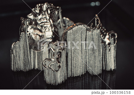 Object printed on metal 3d printer close-up. Object printed in laser sintering machine. Modern 3D printer printing from metal powder. Concept progressive additive DMLS, SLM, SLS 3d printing technology 100336158