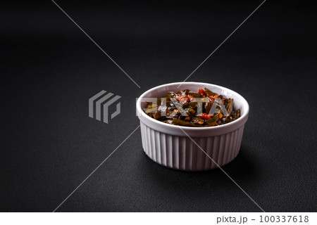 Delicious marinated seaweed with paprika, spices and salt Delicious marinated seaweed with paprika, spices and salt 100337618