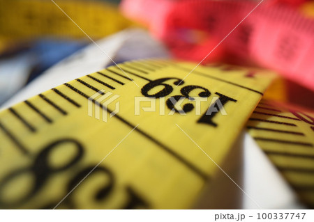 Tailor's measuring tape close-up. Tailor's measuring tape close-up. 100337747