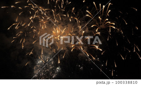 fireworks background. festive fireworks sky. new year, independence day, christmas, birthday. explosion colored lights. fiery flame sky. happy holiday. traditional holiday festival. fire spark effect 100338810