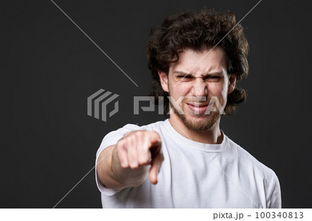 amazed caucasian man pointing finger at you 100340813