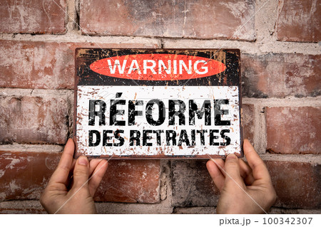 PENSION REFORM in French. Warning sign with text 100342307