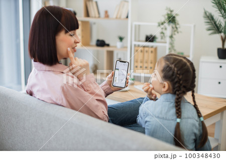 Mother teaching daughter rules of buying cosmetics online Mother teaching daughter rules of buying cosmetics online 100348430