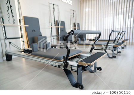 Two reformer machines. Pilates studio without people. Two reformer machines. Pilates studio without people. 100350110