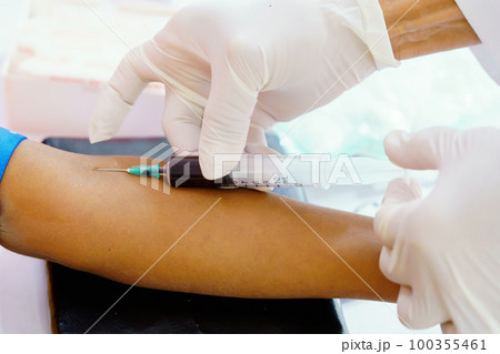 Nurse collecting a blood from patient in hospital 100355461