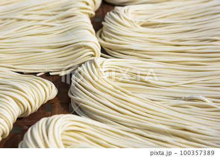 Close-up of traditional handmade noodle-making drying outdoors in Guanmiao, Tainan, Taiwan. 100357389