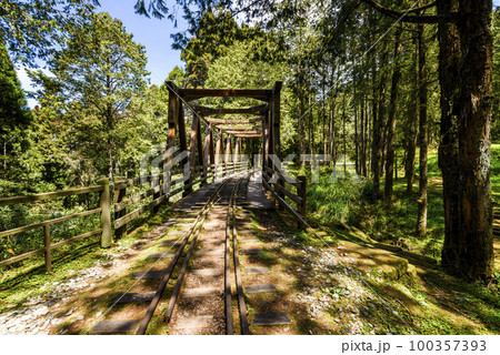 The old forest railway section of the Shuishan Trail at Alishan Forest Recreation Area in Chiayi, Taiwan. Now obsolete and unable to operate. The old forest railway section of the Shuishan Trail at Alishan Forest Recreation Area in Chiayi, Taiwan. Now obsolete and unable to operate. 100357393