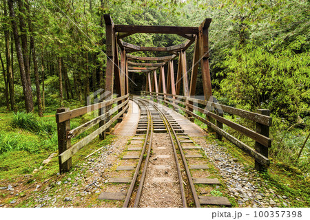 The old forest railway section of the Shuishan Trail at Alishan Forest Recreation Area in Chiayi, Taiwan. Now obsolete and unable to operate. The old forest railway section of the Shuishan Trail at Alishan Forest Recreation Area in Chiayi, Taiwan. Now obsolete and unable to operate. 100357398