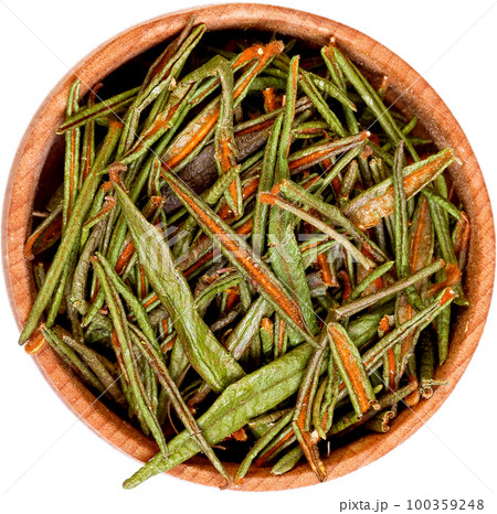 Marsh or Northern Labrador Tea, Ledum palustre in a small wooden bow isolated on white. Marsh or Northern Labrador Tea, Ledum palustre in a small wooden bow isolated on white. 100359248