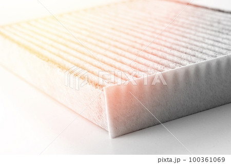 new carbon filter of the cabin of the car on a white background new carbon filter of the cabin of the car on a white background 100361069