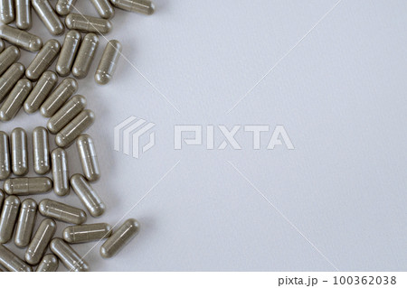 Vitex brown capsules on a beige background. Supplements, drugs and pills. Copy space for text. Flat lay, top view. Design for text. Directly Above View. 100362038