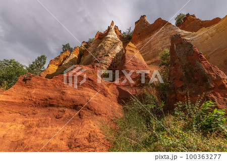 Red ocher cliff in the Luberon in Provence. Red ocher cliff in the Luberon in Provence. 100363277
